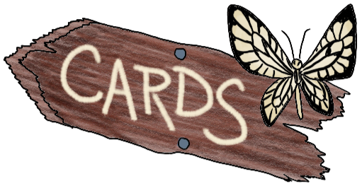 Holiday Cards - printed on a wooden signboard, pointing left/up/forward, with a paper kite butterfly.